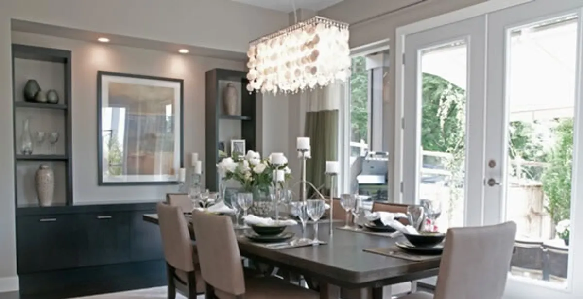 Elegant dining room chandelier installation above table in Richmond, VA