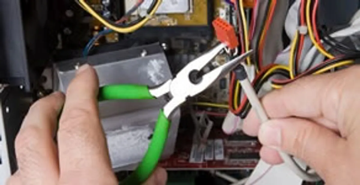Licensed electrical contractor performing electrical repair with tools in Mechanicsville, VA
