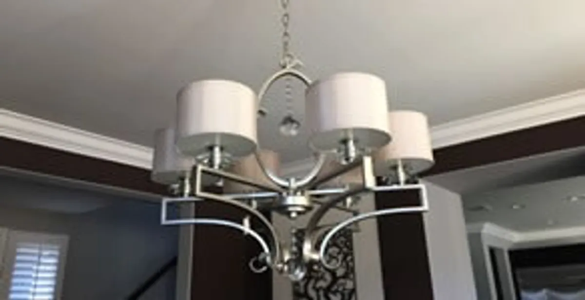 Modern chandelier installation with multiple light fixtures in Richmond, VA